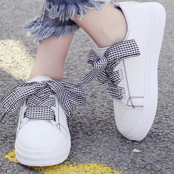 white sneakers with ribbon laces